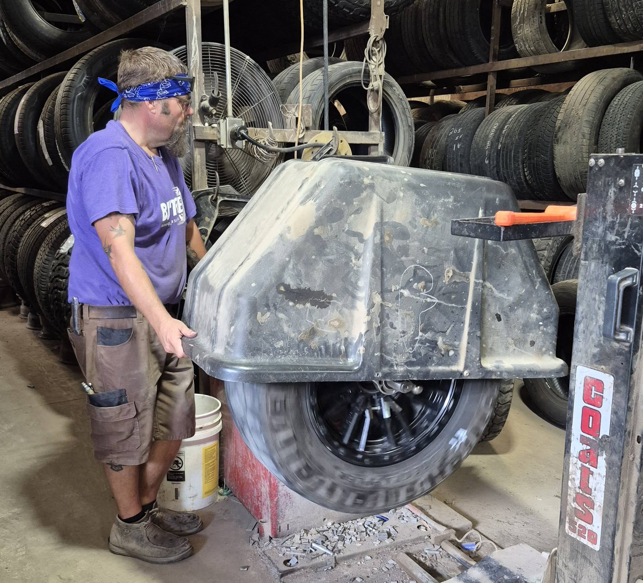Ethan working on a wheel in the tire bay