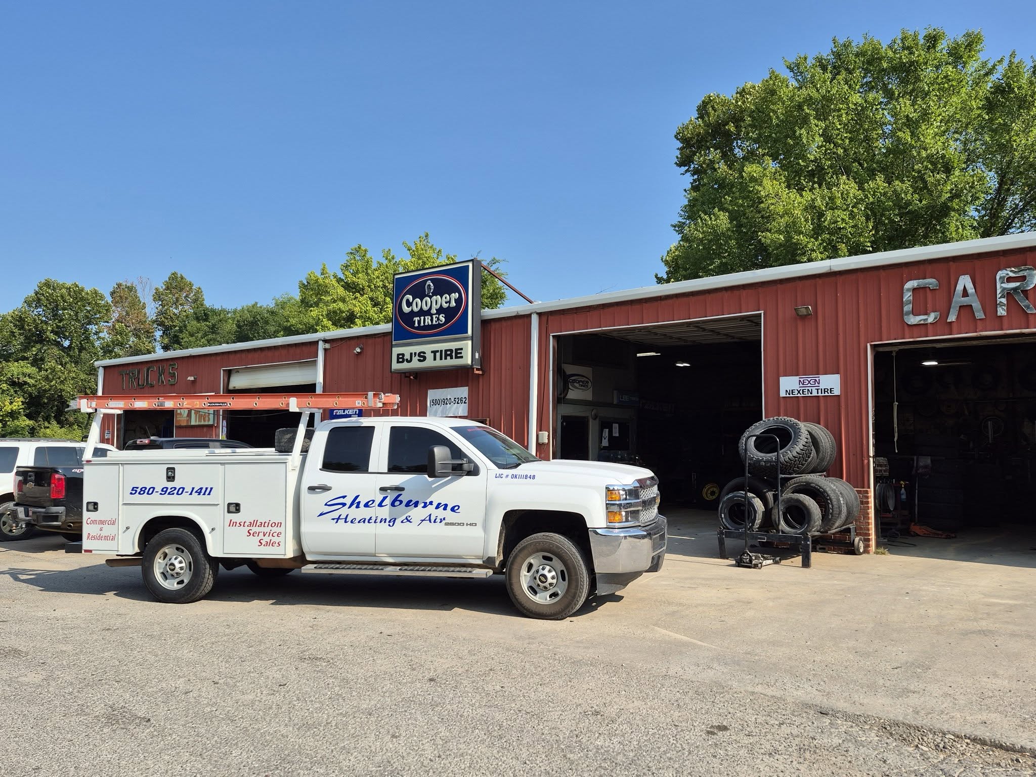 BJ's Tire shop front on Business 70 in Durant with a service truck out front