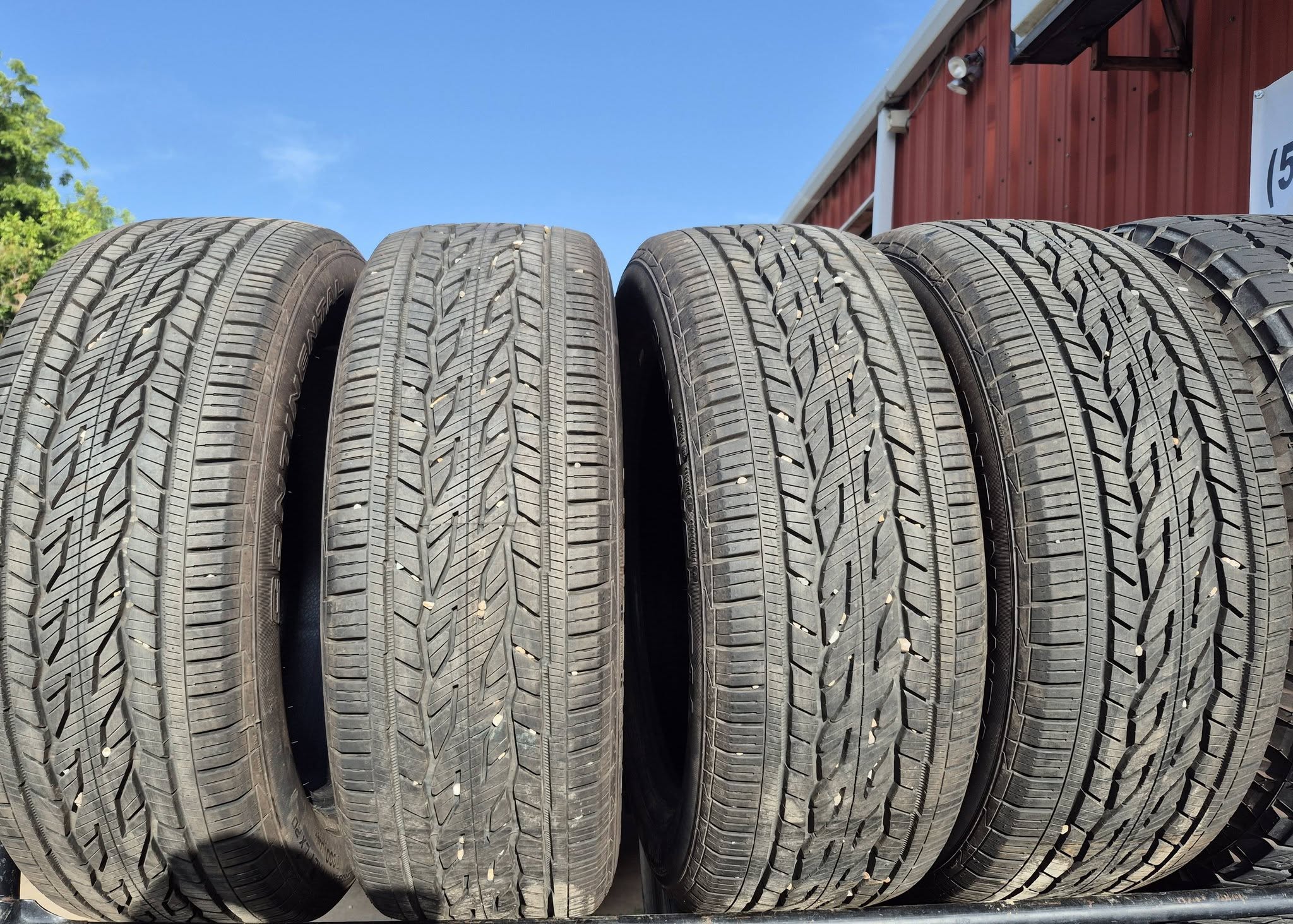Close-up of tire tread on the rack outside the shop