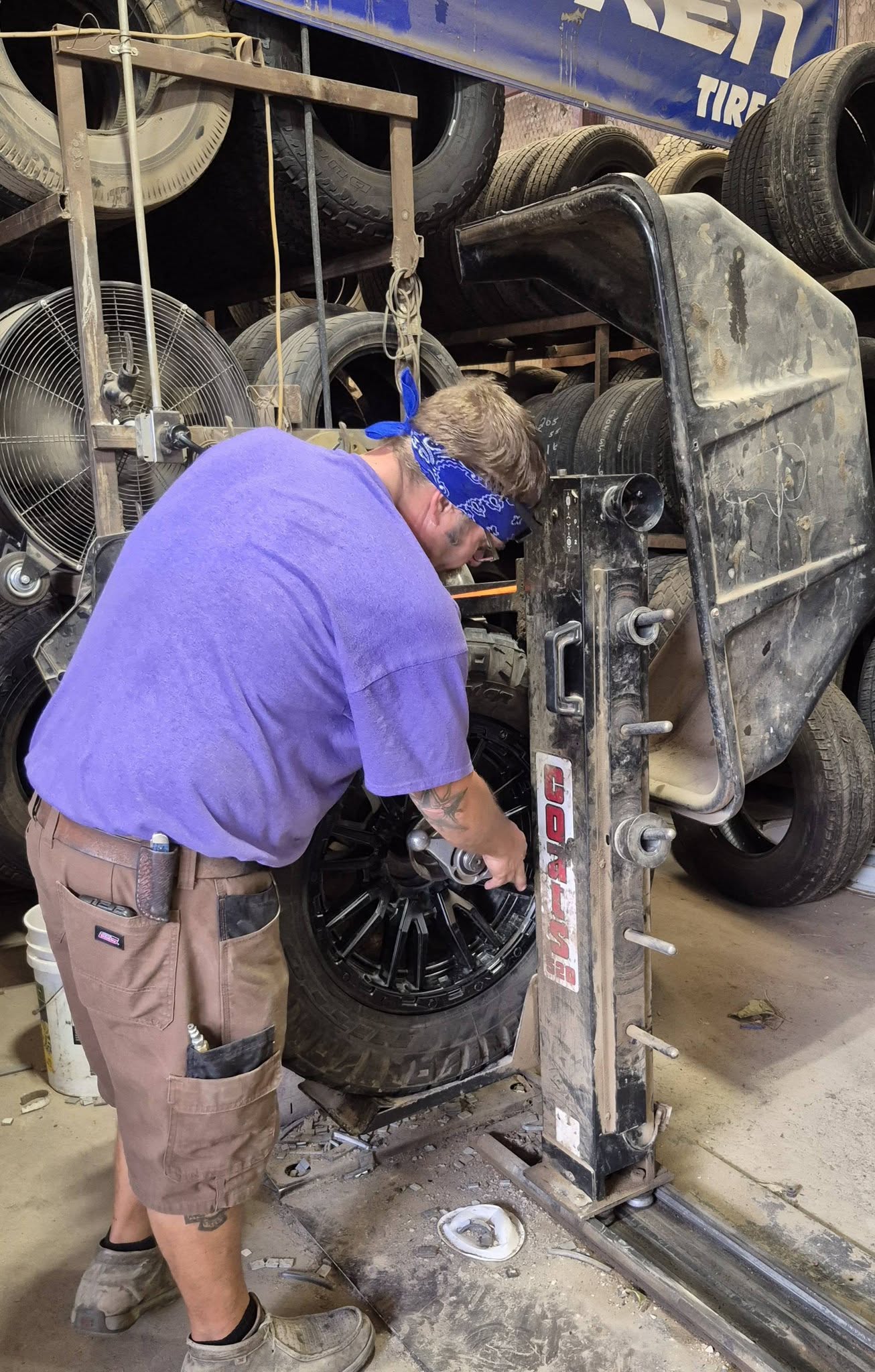 A technician torquing a wheel in the shop